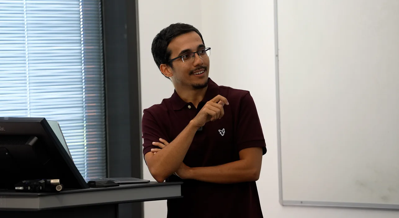 A Decart team member speaking with students
